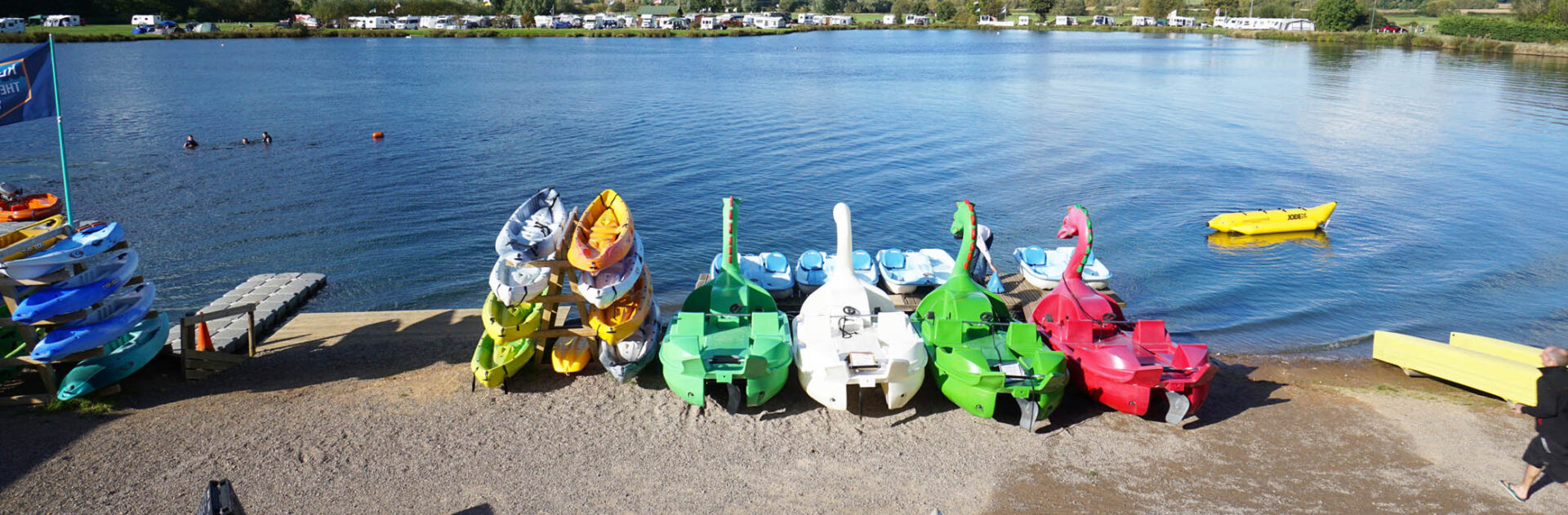 Tranquil water and bright sunshine at Croft Farm's lake