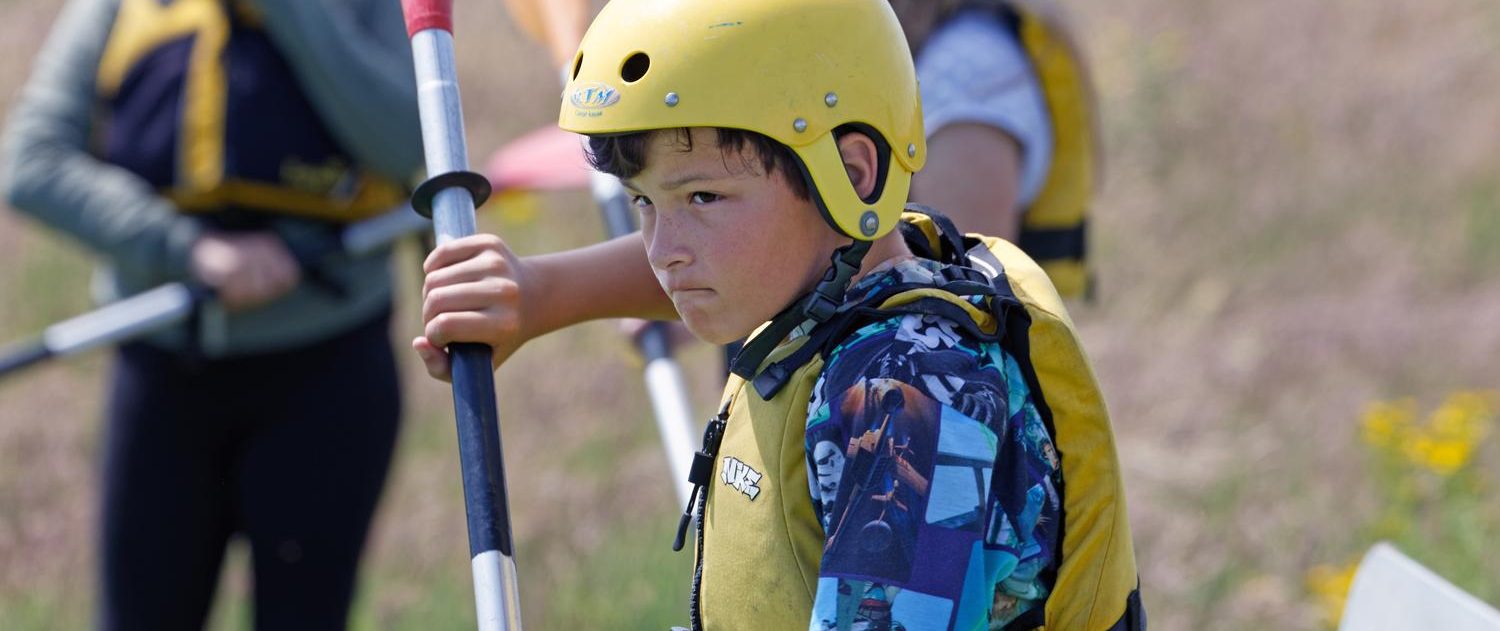 Boy kayaking with JCA