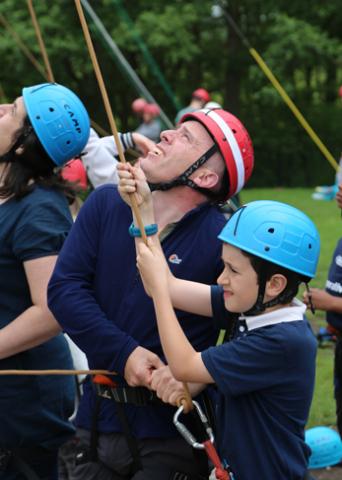 Father and son on high ropes