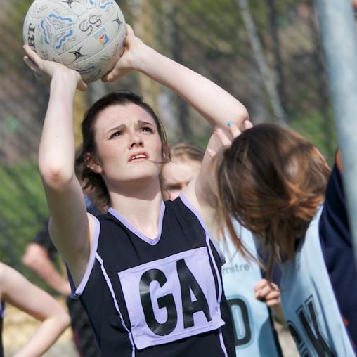 Young netballer shooting for the hoop at Condover Hall