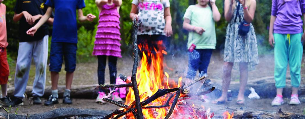 Young students around the campfire