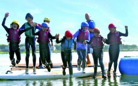 Students jumping into water at Croft Farm