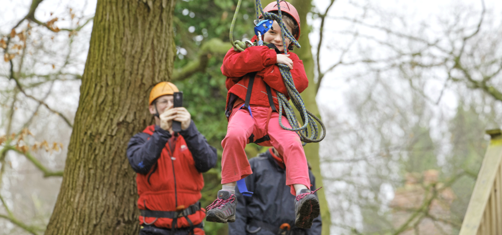 Parent taking pictures on adventure holiday