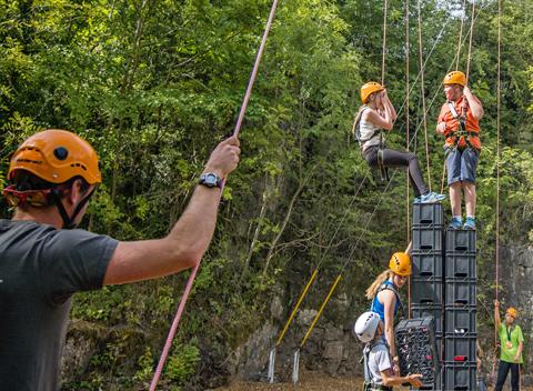 Instructors supporting the crate stack activity