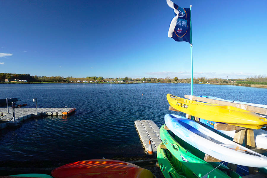 Canoes stored next to the lake at Croft Farm