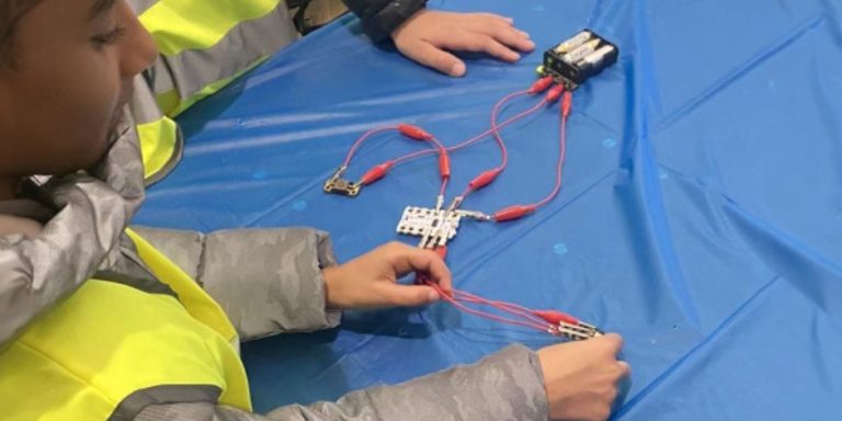 A student participating in a Robotics workshop