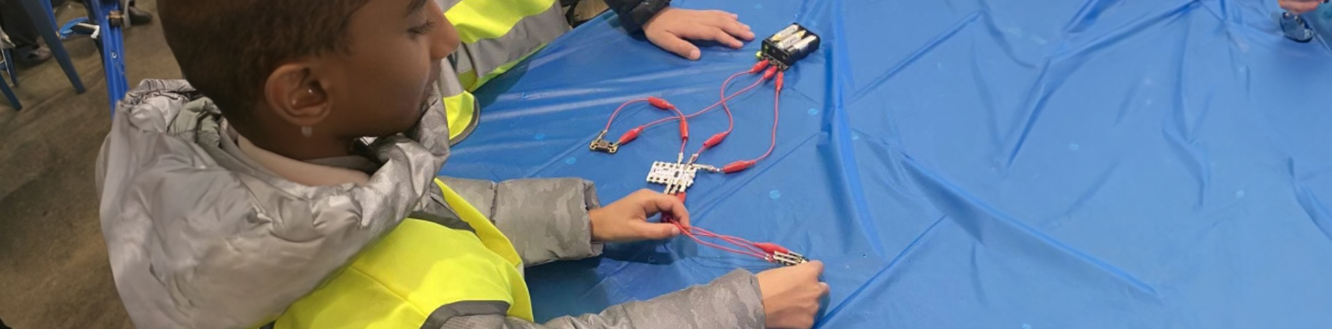 A student participating in a Robotics workshop