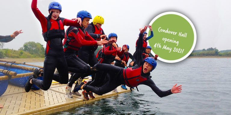 Students jumping off raft